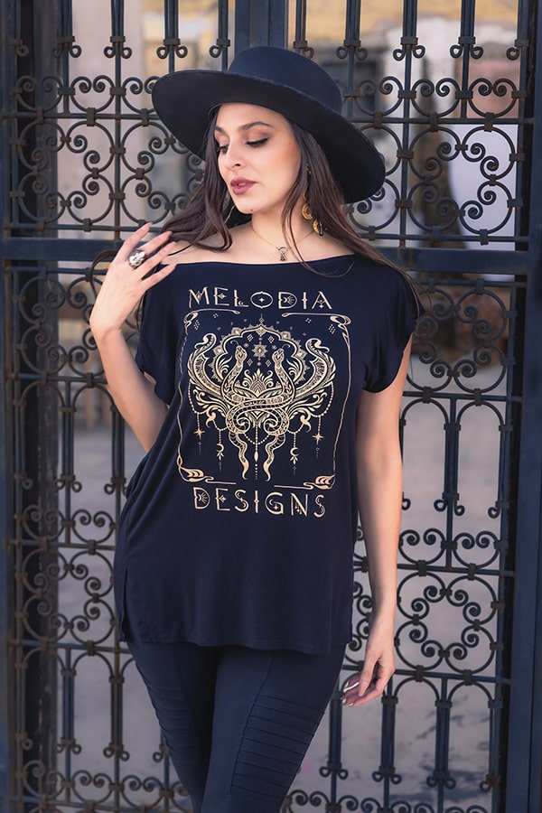 Model wearing Nouveau Serpent Tunic and Moto Xtreme Pocket Legging, serpent design wrapping the body like wearable art.